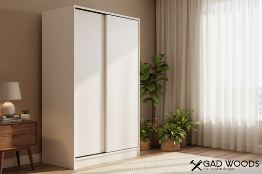 White wardrobe with sliding doors in a room setting, featuring the 'GAD WOODS' brand.